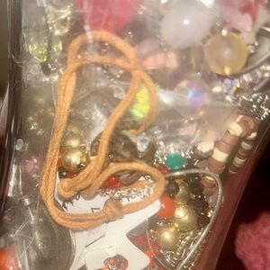 Vase of costume jewelry all kinds of pieces